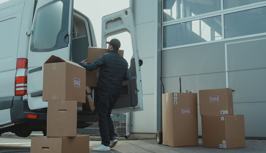 Delivery van being loaded with parcels